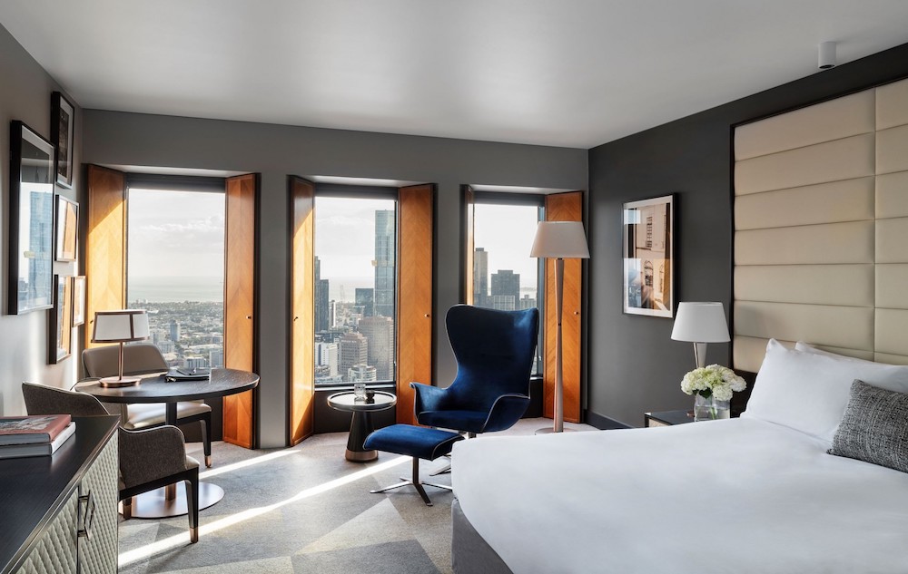 Sofitel Melbourne on Collins' neutral rooms, windows open and looking out at the cityscape.