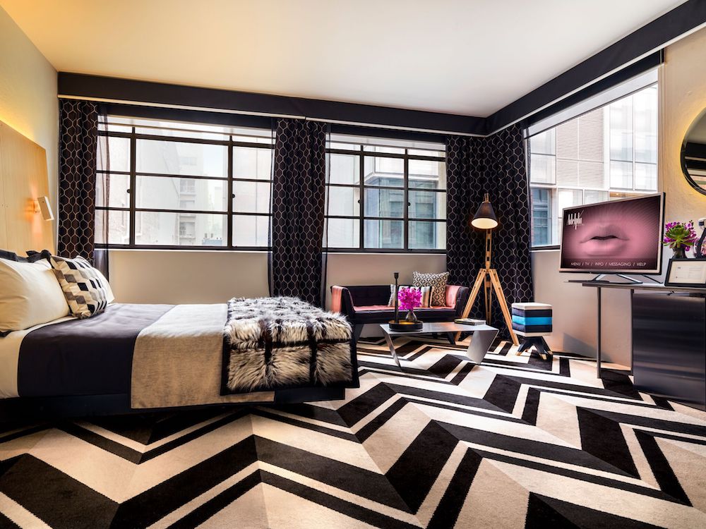 Statement black and white chevron carpet and a neutral bed at Adelphi.

Luxury Hotels in Melbourne